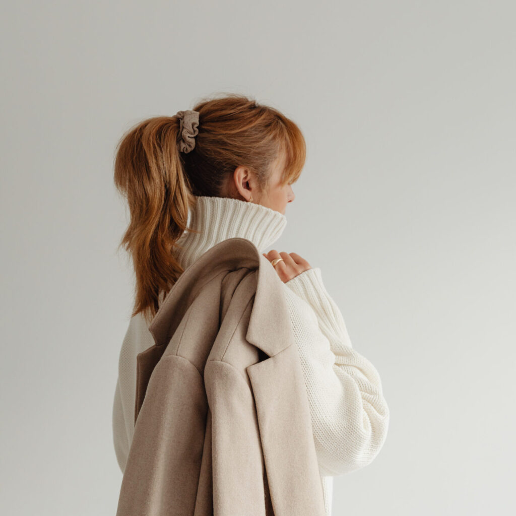 kaboompics woman in white sweater beige wool jacket 29429